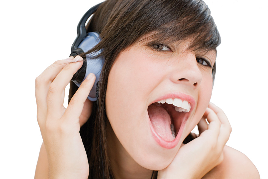 Girl wearing headphones and singing